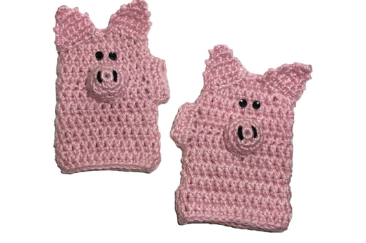 two pink crochet pig gloves